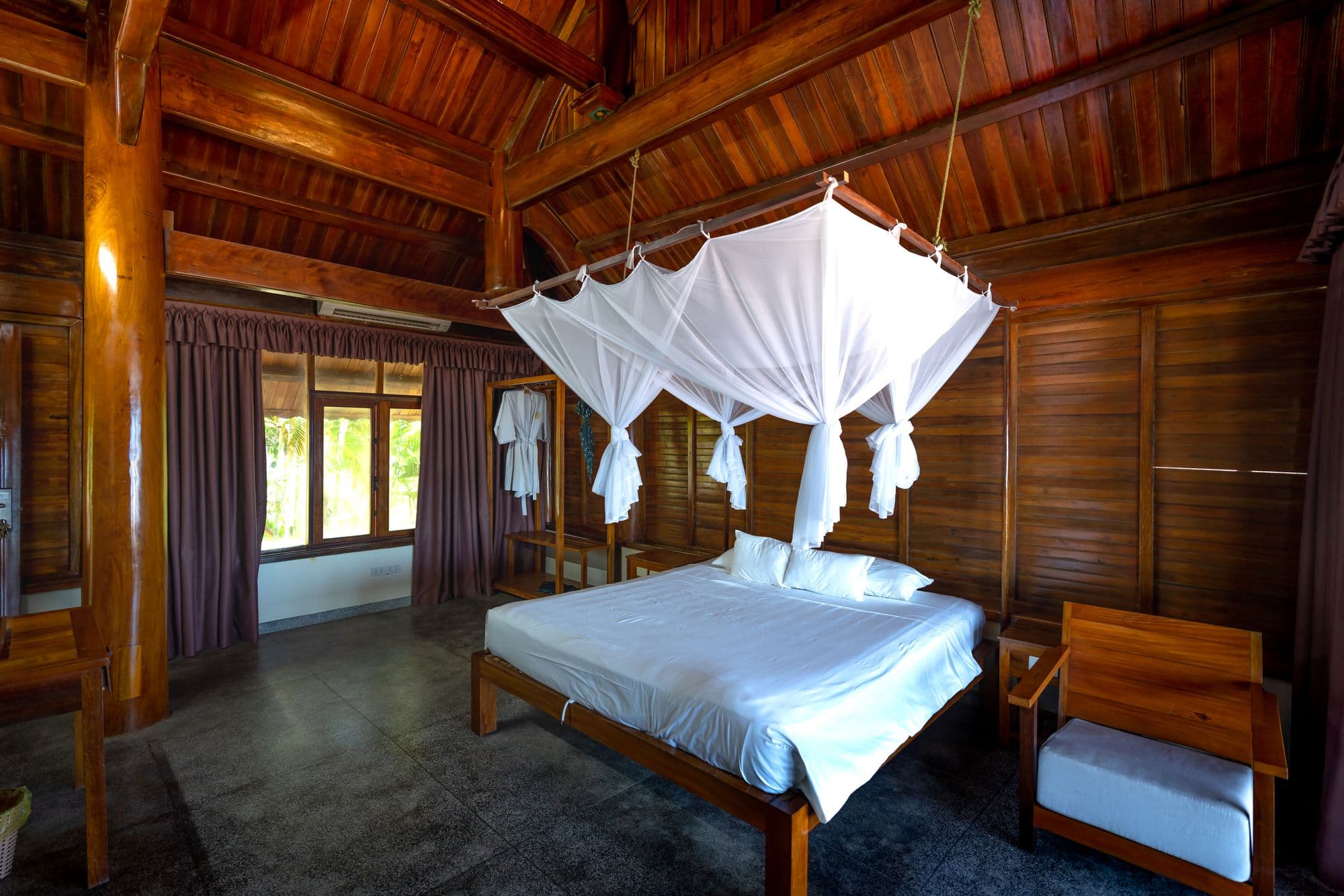 Cozy villa bedroom with a canopy bed