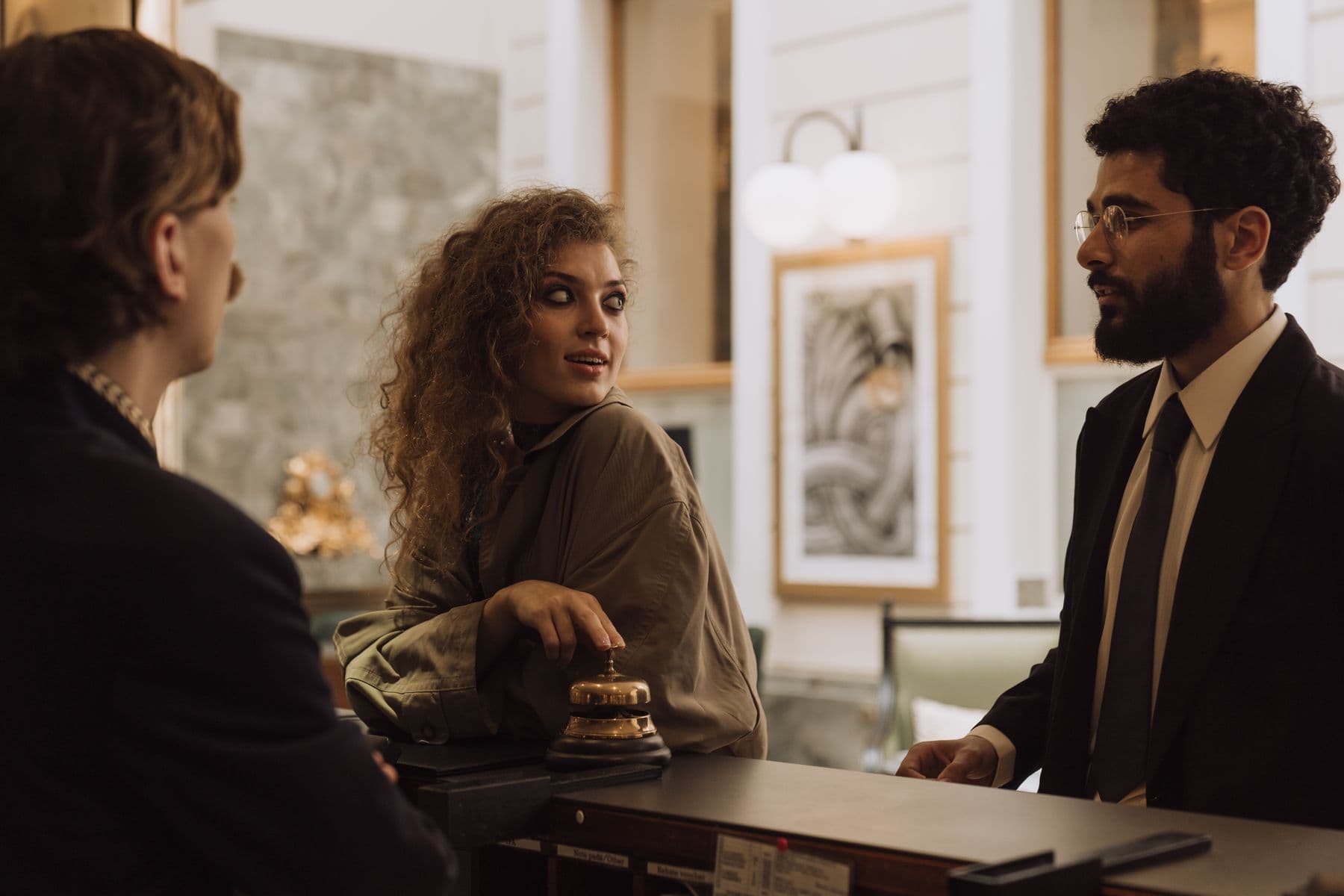 Guests at a hotel reception desk